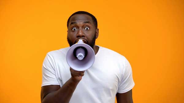 man yelling in megaphone best call to action example