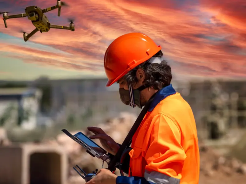 man operating company drone as it takes off