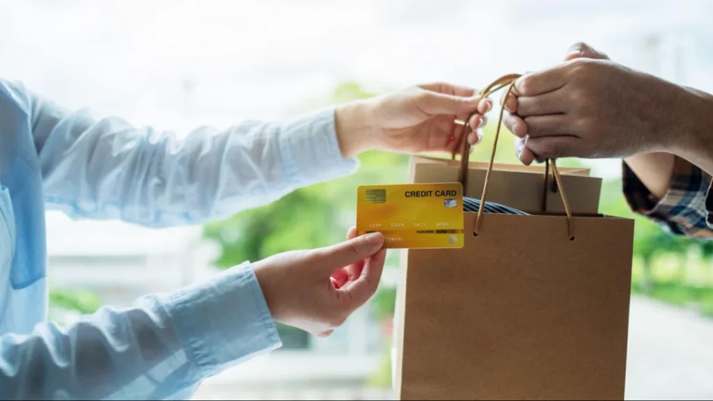 person shopping and buying goods with a credit card small business website gift concept